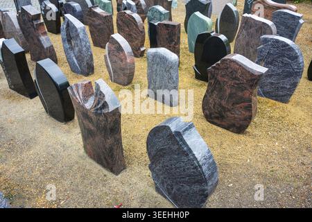 Tombstones of various colours and shapes. Stock Photo