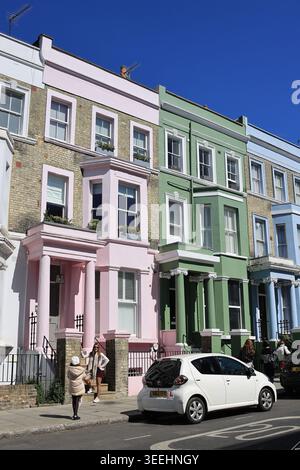 The pretty pastel colours of houses on Westbourne Park Road, where influencers love to photograph, in Notting Hill, west London, UK Stock Photo