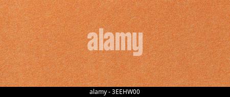 Orange suede fabric background with matte microfiber texture, soft apricot felt surface, macro. Stock Photo
