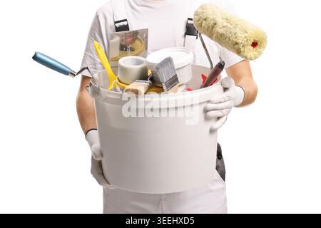 House painter holding a bucket with brushes isolated on white background Stock Photo