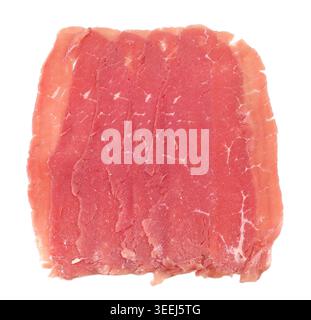 Slices of Carne Salata, traditional salted beef salami from the Trentino region in Italy. White background. Stock Photo
