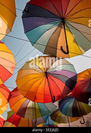 Abstract full-frame overhead pattern layout of overlapping colorful open paper umbrellas, George Town, Penang, Malaysia Stock Photo