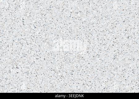 Close-up of a synthetic quartz surface with fine mineral grain. Neutral gray and white stone texture for interior design, architecture, and constructi Stock Photo