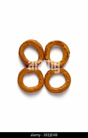 Salted pretzels with poppy seeds isolated on white background Stock Photo