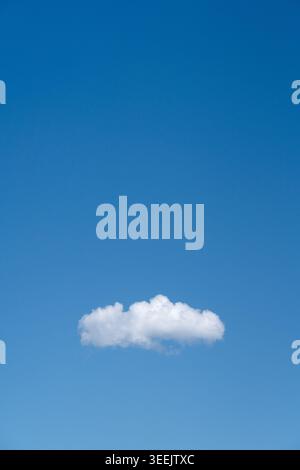 Single cloud in blue sky. Stock Photo