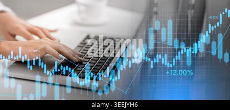 Unrecognizable girl working on her laptop at office Stock Photo