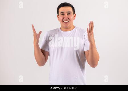 Young man gesturing with hands - looking surprised or explaining something Stock Photo