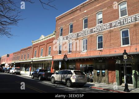 Historic Opera House Brick Facade. large red-brick historic building in Berlin, Maryland, with multiple upper-floor windows, painted wall lettering, Stock Photo