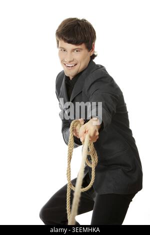 Businessman pulling on a rope. Isolated on white Stock Photo