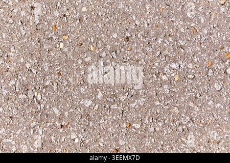 Close up macro texture of rough asphalt with gravel and stone inlays. High quality photo Stock Photo