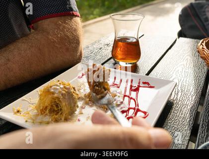 Baklava Ramadan Dessert with Ice Cream, Eastern Sweet Pastries, Turkish Kataifi Baklawa, Traditional Oriental Desert Mix, Baklava Tea Set on White Res Stock Photo
