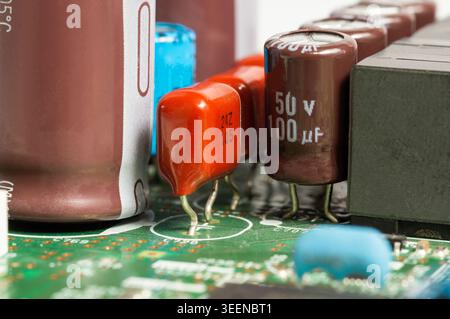 Close-up view of a circuit board with electronic components and connectors. Detailed macro image of modern technology hardware used in computers, comm Stock Photo