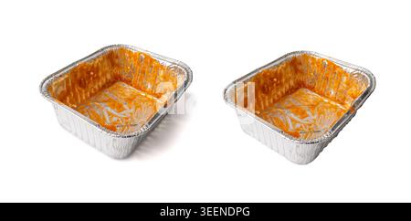 Empty aluminium foil tray isolated, lasagne food remains in dirty packaging for heating, aluminum container, airplane food waste, meal completion, mes Stock Photo