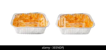 Empty aluminium foil tray isolated, lasagne food remains in dirty packaging for heating, aluminum container, airplane food waste, meal completion, mes Stock Photo