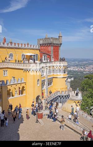 the dominant palace of pena sits on top of a hill in sintra portugal and can be seen from miles aroind. Stock Photo