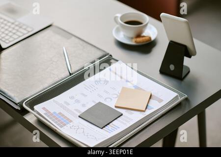 Business Desk Displaying Financial Reports for Planning and Analysis Stock Photo