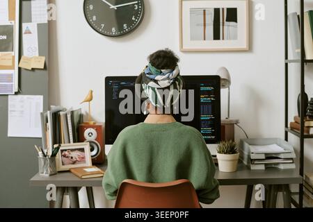 Black Woman Coding at Home Office for Remote Software Work Stock Photo