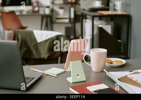Home Office Workspace Featuring Laptop and Tablet for Remote Work Stock Photo