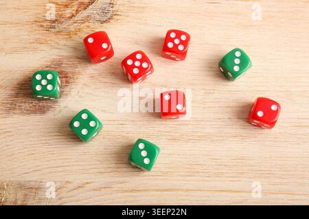Different game dices on wooden background Stock Photo