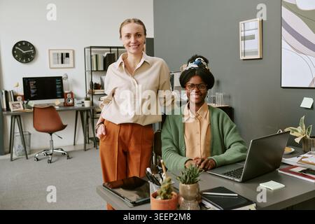 Portrait of Diverse Businesswomen Collaborating in Modern Office Stock Photo