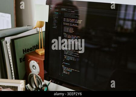 Software Developer Coding on Desktop Monitor for Technology Work Stock Photo