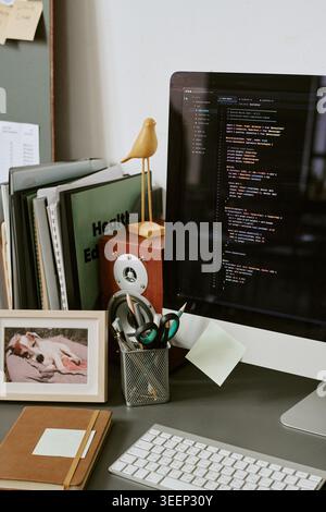 Software Developer Workspace Displaying Code for Web Development Stock Photo