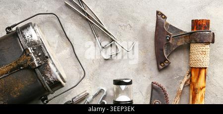 Set of items for camping on grey grunge background Stock Photo