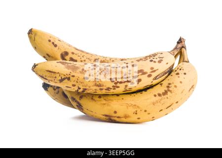 Ripe bananas with brown spots arranged in a small bunch on a white background, highlighting natural ripening, soft texture and sweetness, ideal for ba Stock Photo