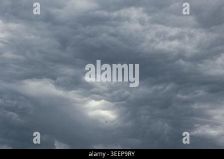 Dramatic dark sky. Heavy gray clouds background photo. Stock Photo