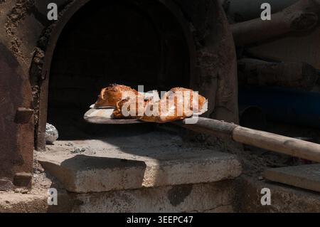 Traditional Cypriot easter pastries made with mixture of various cheese and halloumi, baked in clay oven flaounes flaouna Stock Photo