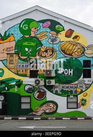 Brightly coloured cartoon style public wall mural with playful characters and graphic shapes on a building facade, Ipoh, Perak, Malaysia Stock Photo