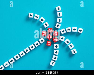 Business crisis and system failure concept with broken gear icons and arrows on blocks over blue background Stock Photo