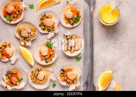 Cooked scallops with sauce on a baking sheet Stock Photo