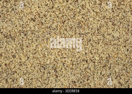 Detailed texture background of ground walnut kernels Stock Photo