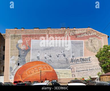 A mural in Budapest shows the historic match where Hungary beat England 6-3 at Wembley Stadium on November 25, 1953. Stock Photo