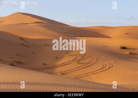 Car tracks in sand on the sand dunes, Sahara Desert in Morocco, Africa Stock Photo