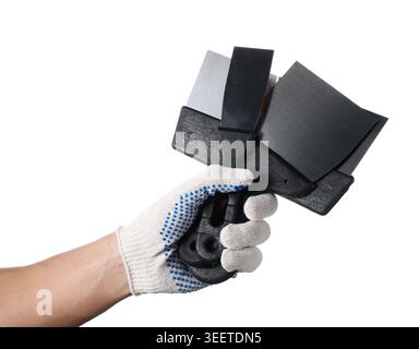 Handyman with putty knives on white background, closeup Stock Photo
