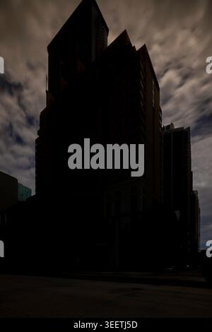 Long exposure photo moody sky over a group of highrise buildings Stock Photo