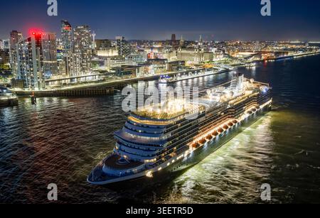 Liverpool Cruise Terminal at dusk, Merseyside, England. Elevated view of a cruise ship alongside the historic Pier Head waterfront. Stock Photo