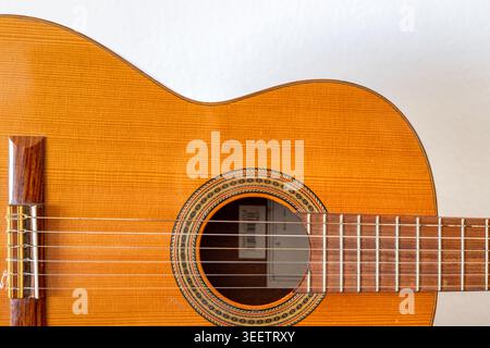 Detail of classical acoustic guitar with strings and sound hole Stock Photo