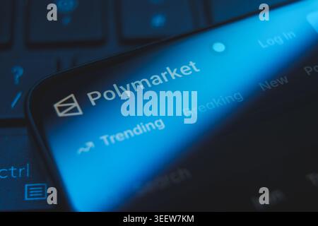 Polymarket website logo and interface displayed on a smartphone screen, decentralized prediction market platform for cryptocurrency betting and Stock Photo