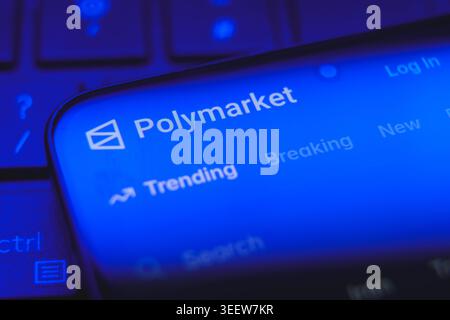 Polymarket website logo and interface displayed on a smartphone screen, decentralized prediction market platform for cryptocurrency betting and Stock Photo