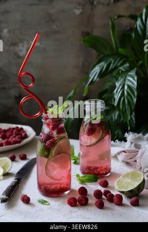 Refreshing berry mocktails in urban garden mixologist display Stock Photo