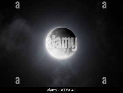Mysterious Cloudy Sky During Partial Moon Eclipse Stock Photo