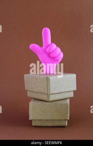 Hand raised, ready to deliver two boxes Stock Photo