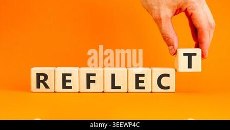 Reflect word symbol. Concept word Reflect on beautiful wooden blocks. Beautiful orange background. Psychologist's hand. Business psychological reflect Stock Photo
