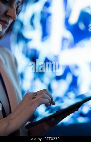 Using AI model, tablet closeup and computer scientist solving tasks with machine learning. Using application, device and software developer using artificial intelligence neural network Stock Photo