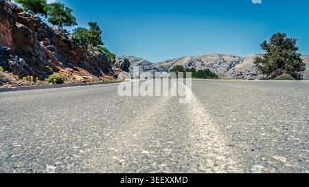 Two lane winding road through Dikti Mountains in eastern Crete, Greece Stock Photo