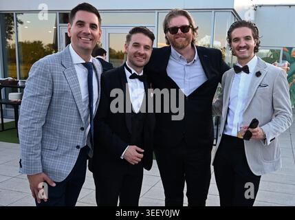 Four handsome men in formal suit having fun Stock Photo