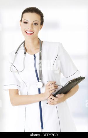 Female doctor using tablet computer, isolated on white Stock Photo